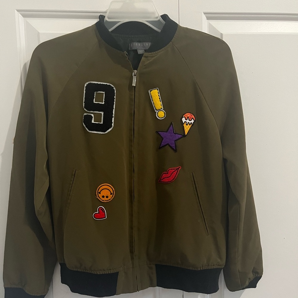 a greenish jacket
